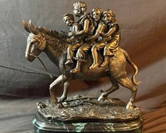 Sculpture of Four Children Riding a Donkey on Marble Base