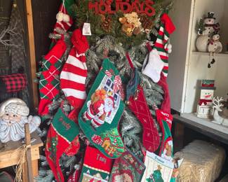 A vintage Christmas Tree filled with Stockings for everyone