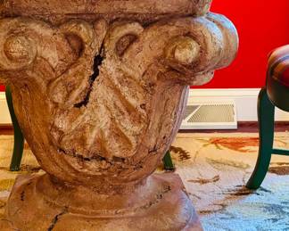 Monumental cast table base with glass top (detail)...