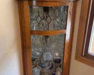Corner cabinet full of vintage glassware 