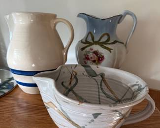 Many crocks, pottery, and pitchers