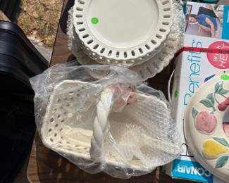 Ceramic plates with a pierced rim design and matching basket