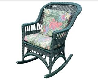 Green Wicker Rocking Chair With Floral Upholstery And Pillows