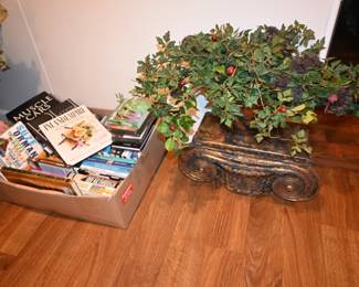 Books, artificial plants, wall sconces