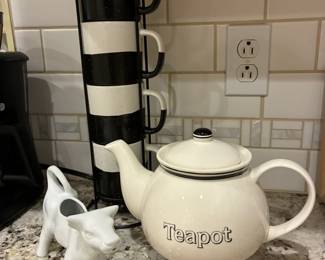 Teapot $10; Cow creamer $8; Mug stack $10