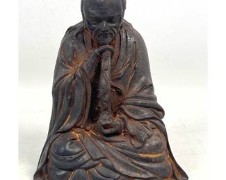Lot 1815 Japanese Cast Iron Seated Figure of a Luohan or Zen Immortal holding a Gnarled Staff