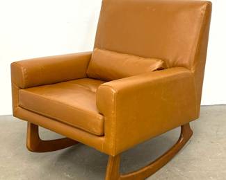 Lot 1477 Mid Century Modern style Rocking Armchair in Cognac Faux Leather. Bowed Wood Rockers.