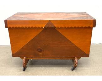 Lot 1423 Folk Art Two Tone Pine Storage Trunk on Casters with Hand Carved Scalloped Trim and Geometric Design