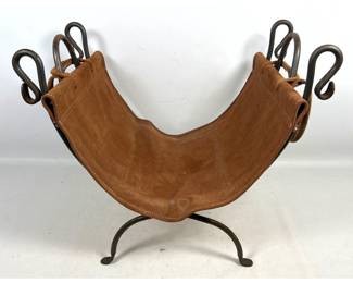 Lot 1699 Wrought iron and suede leather fireplace log carrier and stand with scrolled finials. Unsigned.