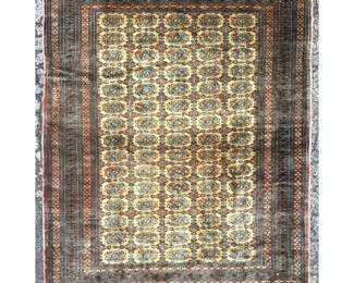 Lot 2081 7 X 9 11 Hand knotted wool Bokhara rug with repeating gul pattern on camel ground. Unsigned.