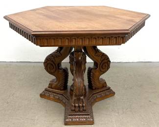 Lot 1794 Renaissance Revival carved walnut hexagonal center table with tripartite lion paw base