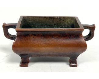 Lot 1823 Small Chinese cast bronze rectangular censer with bridge handles and four cabriole legs bearing a re