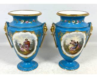 Lot 1880 Pair Neo Classical Sky Blue Porcelain Urns with Gilded Satyr Handles and Hand Painted Scenes. Unsign