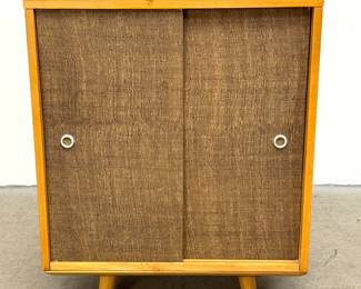 Lot 1443 Paul McCobb Planner Group for Winchendon Maple Cabinet with Textured Sliding Doors and Tapered Legs.