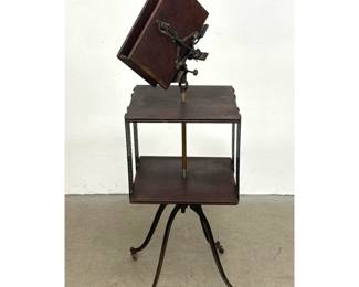 Lot 1727 Late 19th Century American adjustable dictionary stand and 2 tier revolving bookcase with ornate cas