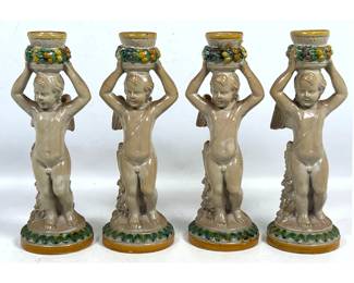 Lot 1929 Set 4 Della Robbia Figural Candlesticks.