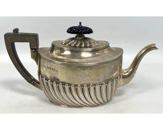 Lot 1807 Late Victorian sterling silver teapot by Henry Harrison Sheffield 1884 with carved wood handle and f
