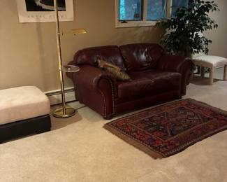 Leather two seat loveseat, vintage rug
