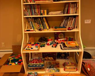 Children's book case with books and toys