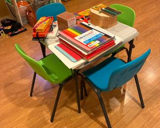 Children's table and chairs, lots of coloring and art items