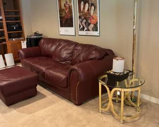 Leather two seat sofa and ottoman