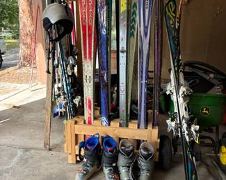 Lots of skis, poles and boots