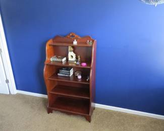 Bookshelf. Various books and items.