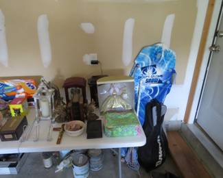 Sled, tennis racquets, clocks, Barbi, miscellaneous items.