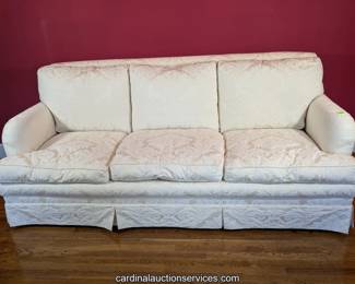 Cream upholstered sofa