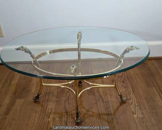Oval glass and brass cocktail table
