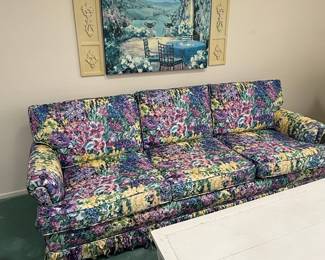 Floral Upholstered Three-Seat Sofa with Skirted Base and Rolled Arms