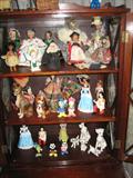 Collection of small dolls, mostly travel souveniers. Also Disney collectibles.