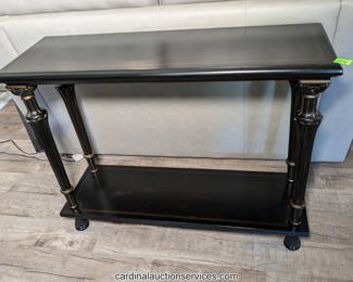 Neoclassical-style ebonized two-tier console table