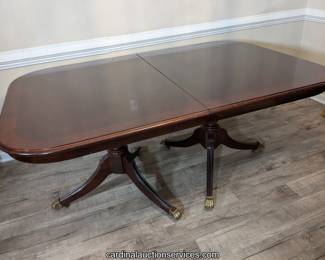 Double pedestal dining table with leaf