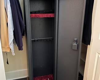 T113 - $75. Metal gun safe with keyed lock. 19.25" x 12" x 60" tall. Excellent condition.