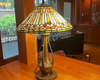 T119 - $450. Pair of Quoizel Lamps with Tiffany Style Lamp Shades. One lamp has a small chip but both are in great condition. Both lamp shades are in excellent condition with no chips or cracks noticed.