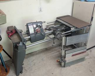 T118 - $150. Shop Smith Lathe model 555483 and Power Station model 555422 with extra parts. Please have help to move.