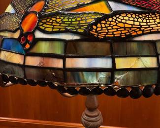 T5 - $125. Quoizel Table Lamp, Tiffany style shade with damage as shown in photo, Dragonfly motif. 18.5" tall.