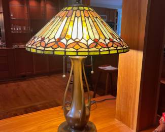 T119 - $450. Pair of Quoizel Lamps with Tiffany Style Lamp Shades. One lamp has a small chip but both are in great condition. Both lamp shades are in excellent condition with no chips or cracks noticed.