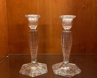 T72 - $25. Vintage Fostoria Floral Etched Candlestick Holders. Measures 8” tall.