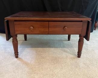 T44 - $60. Wooden Coffee Table with Drop Leaf Sides and 1 drawer. Measures 30" (45" expanded) x 24" x 17" Tall. Very good condition with some surface wear, mainly on legs.