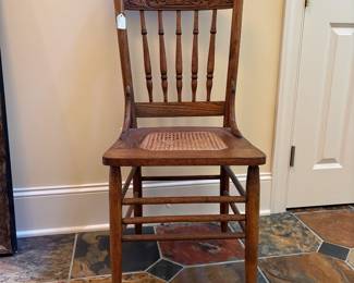 T20 - $30. Antique Caned Chair. Caning needs replaced. Measures 17" x 17" x 38" tall. Floor to seat 17.5". Structurally in very good condition.