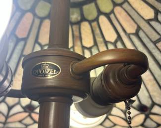 T119 - $450. Pair of Quoizel Lamps with Tiffany Style Lamp Shades. One lamp has a small chip but both are in great condition. Both lamp shades are in excellent condition with no chips or cracks noticed.