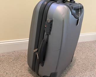 T88 - $25. Delsey Hard Case Carry On Suitcase. Has a lot of wear but clean inside. Measures 21” tall.