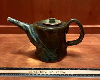 T26 - $20. Unsigned pottery teapot. Measures 9" x 5" tall. Excellent condition.