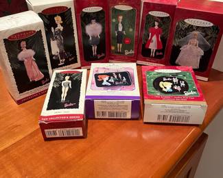 T59 - $45. Lot Of 9 Hallmark Barbie Ornaments.