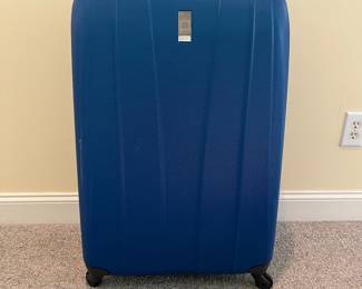T87 - $80. Delsey Hard Case Suitcase. Measures 31“ tall.