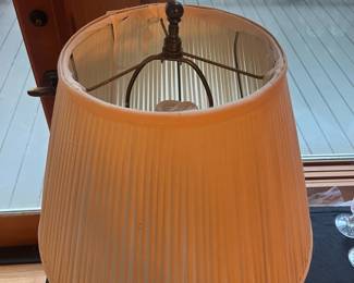 T57 - $60. Asian Style Wood and Porcelain Lamp. Lamp is in good condition and the shade shows signs of age. Measures 29” tall.