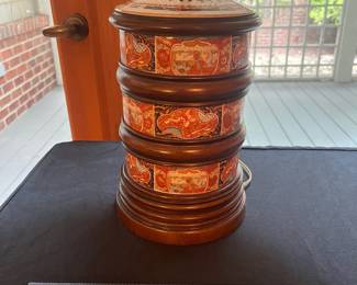 T57 - $60. Asian Style Wood and Porcelain Lamp. Lamp is in good condition and the shade shows signs of age. Measures 29” tall.