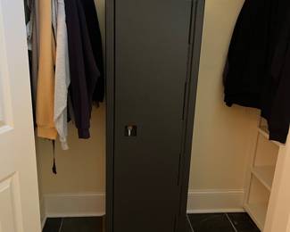 T113 - $75. Metal gun safe with keyed lock. 19.25" x 12" x 60" tall. Excellent condition.